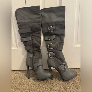 Gray knee-high boots with buckles on the side